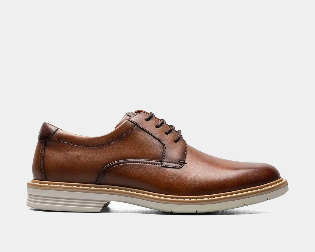 A cognac  Plain Toe Oxford shoe with a leather upper, Suedetec lining, and a modern silhouette.