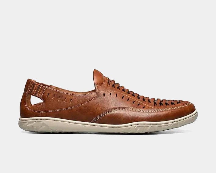 A tan woven vamp moc toe slip-on shoe with a lightweight sole.