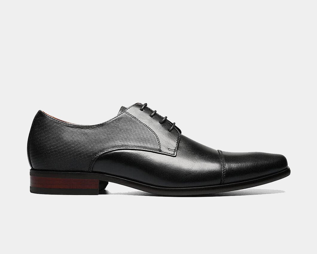 A black Cap Toe Oxford shoe with a leather upper, chiseled toe, and micro-perfing on the collar and heel.