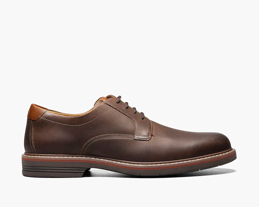 A brown  Plain Toe Oxford shoe with a leather upper, Suedetec lining, and a modern silhouette.