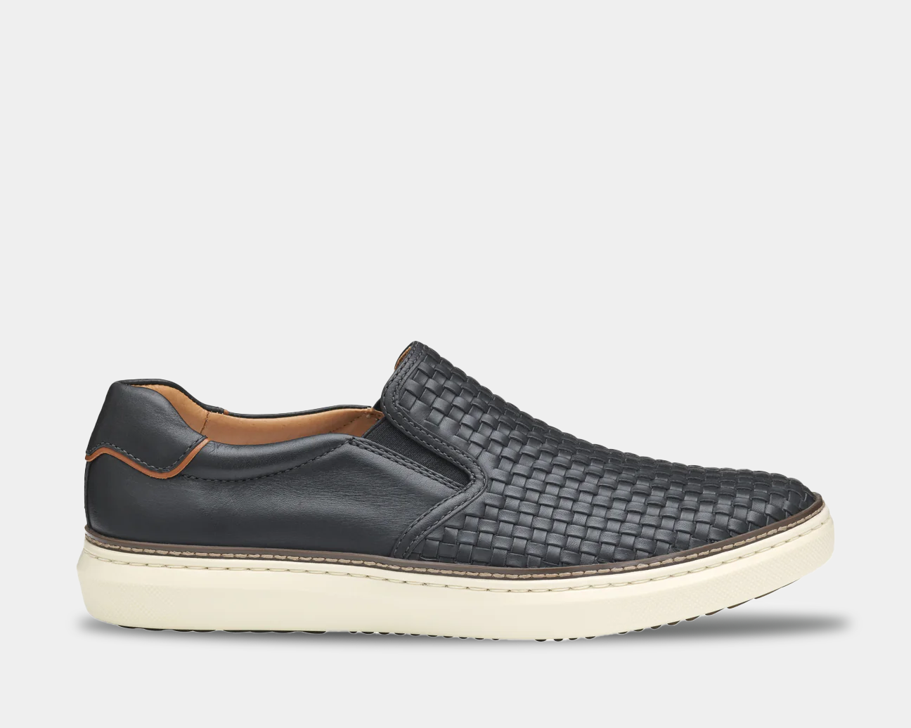 Black woven slip-on shoe with white sole