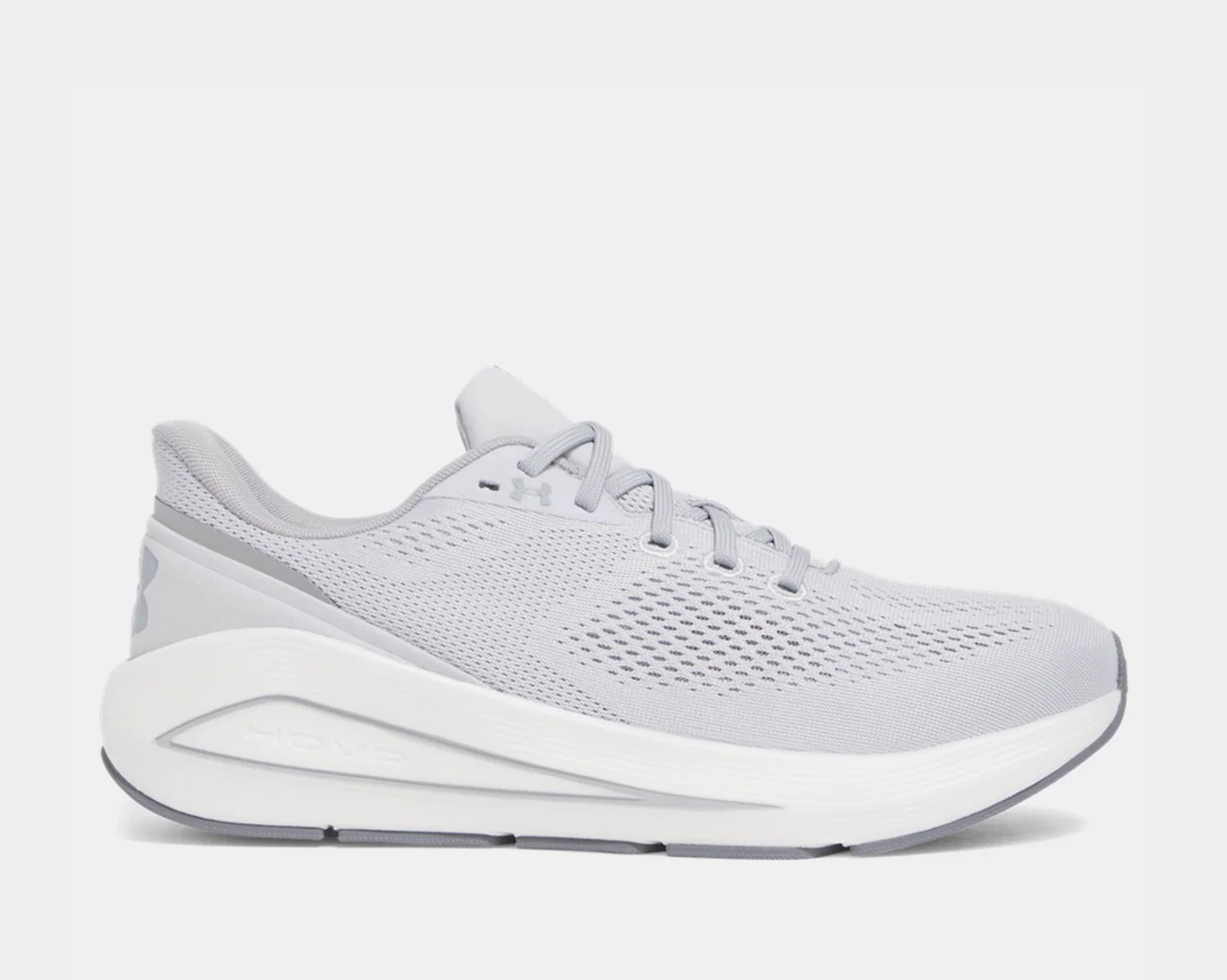 A pair of grey Under Armour HOVR Sonic 7 running shoes with lace-up closure and white detailing.