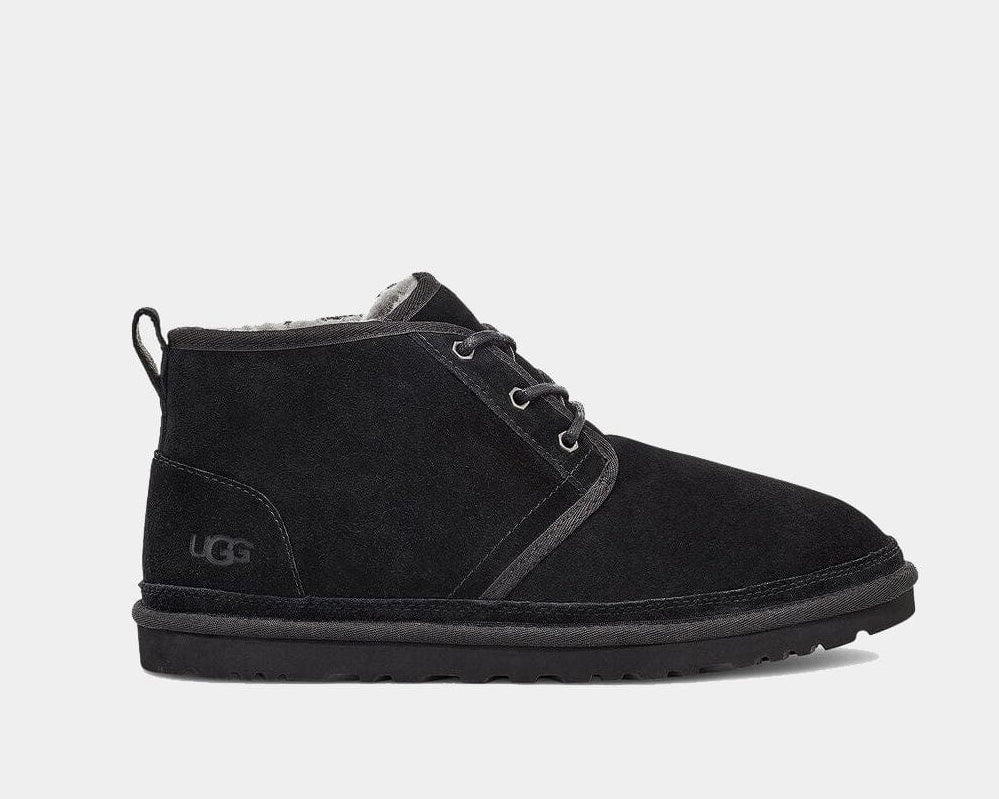 A black suede chukka boot with lace-up closure and the UGG brand logo visible.