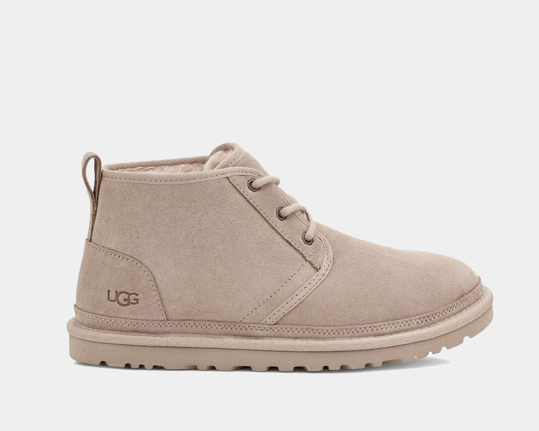 A brown suede chukka boot with lace-up closure and the UGG brand logo visible.