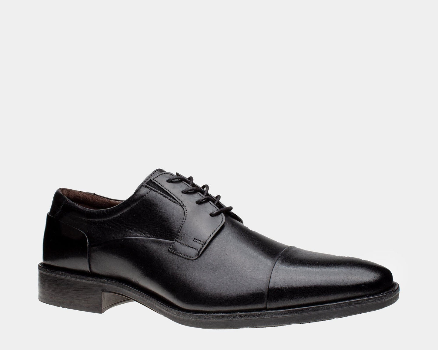 A black leather cap toe Oxford shoe with a cushioned footbed and rubber outsole.
