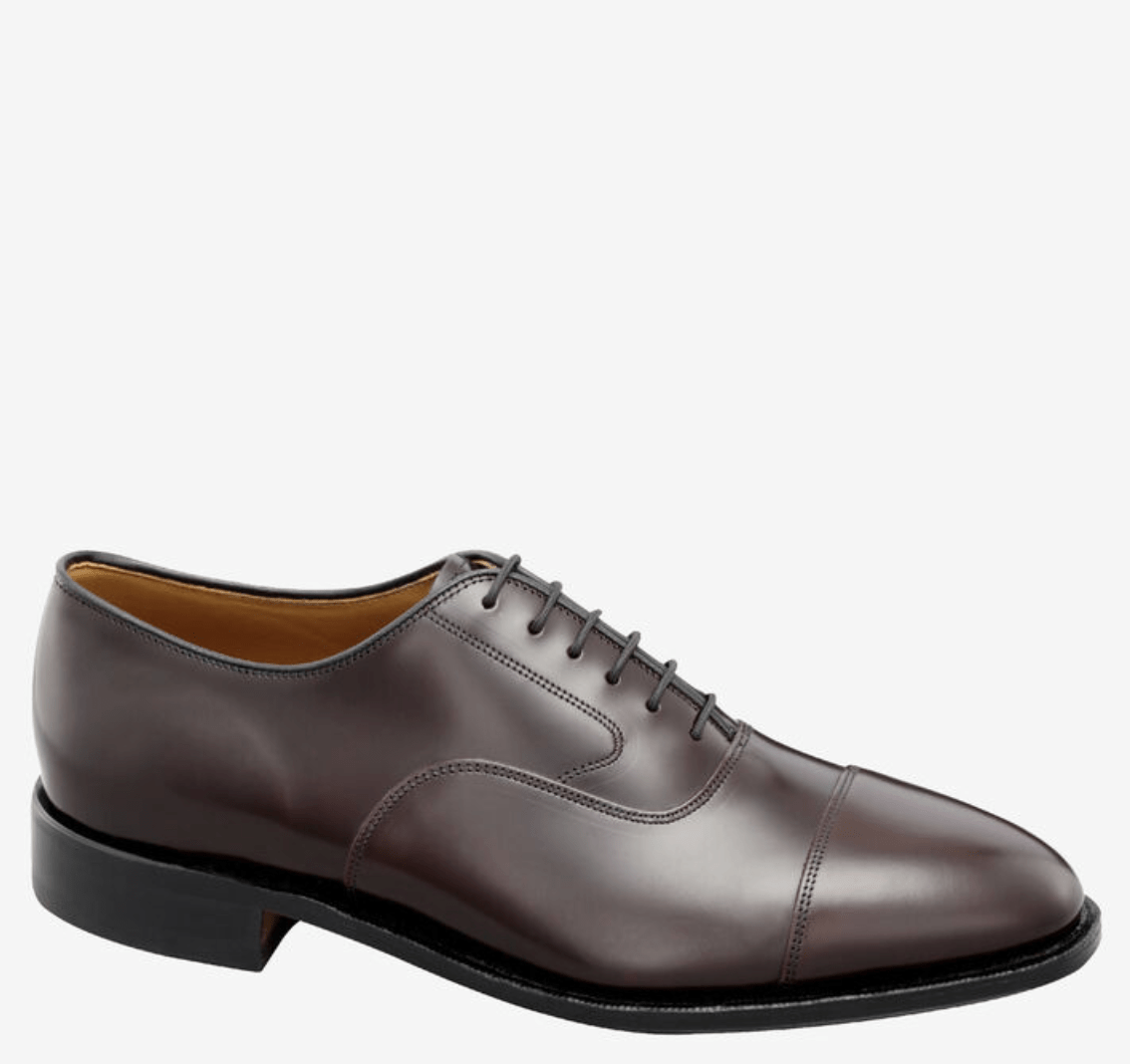 A burgundy leather dress shoe with a lace closure.