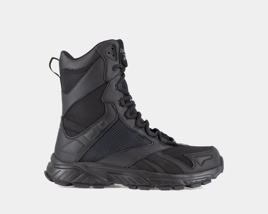 A black tactical trail running boot with a side zipper, designed for stable footing and comfort on rugged terrain.