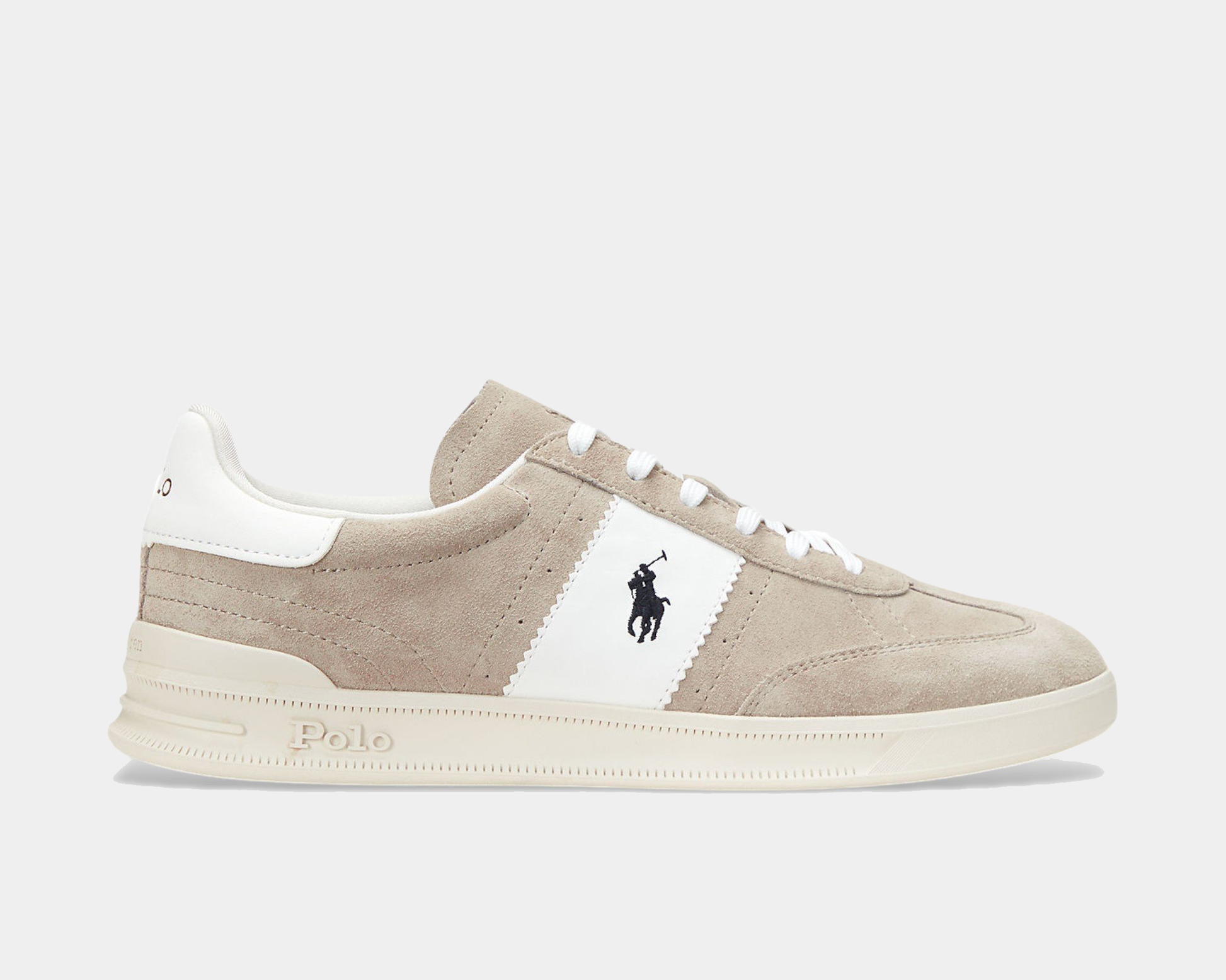 Beige sneaker with white stripe and logo on a light gray background