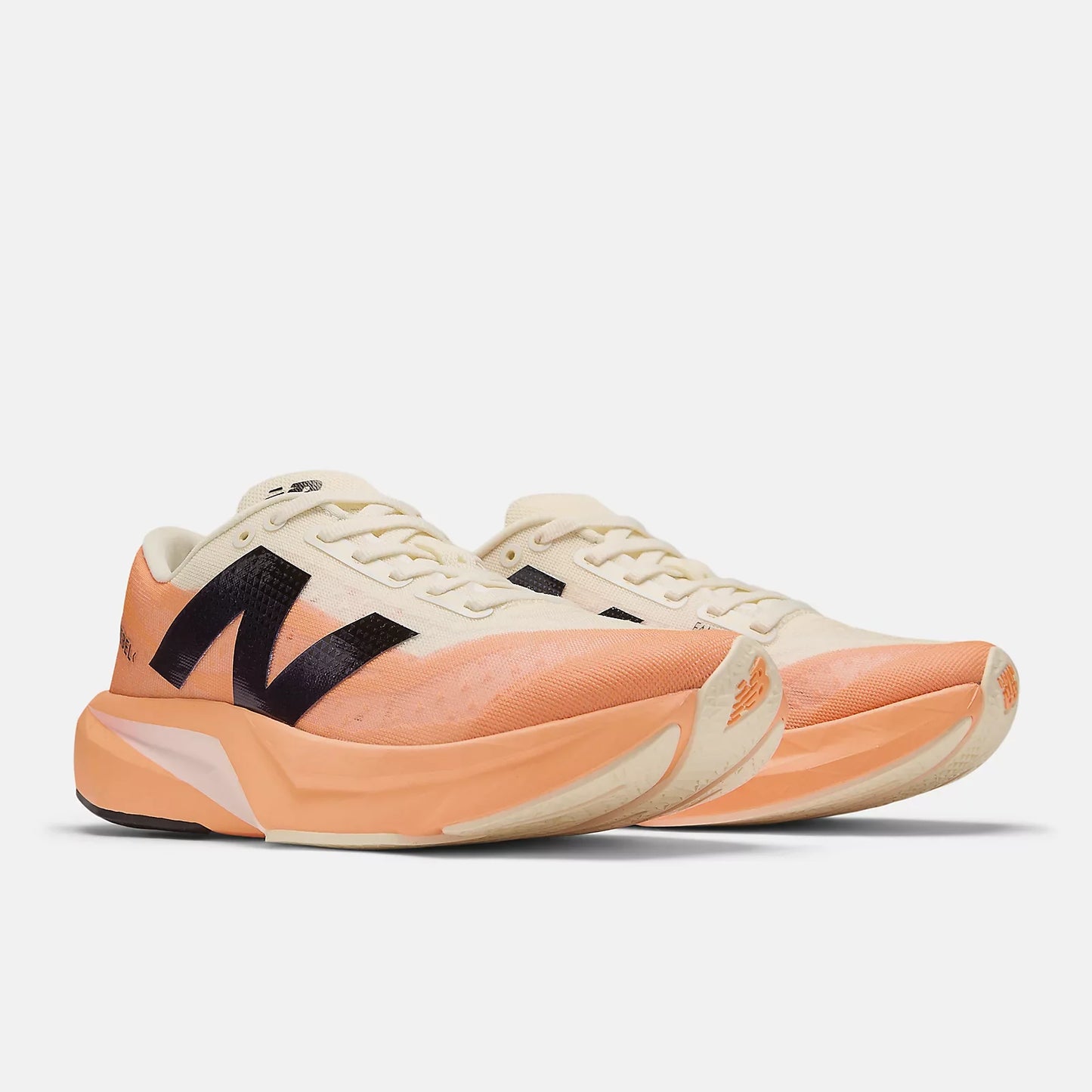 New Balance Women's Fuel Cell Rebel v4 - Hot Mango/Angora/Black